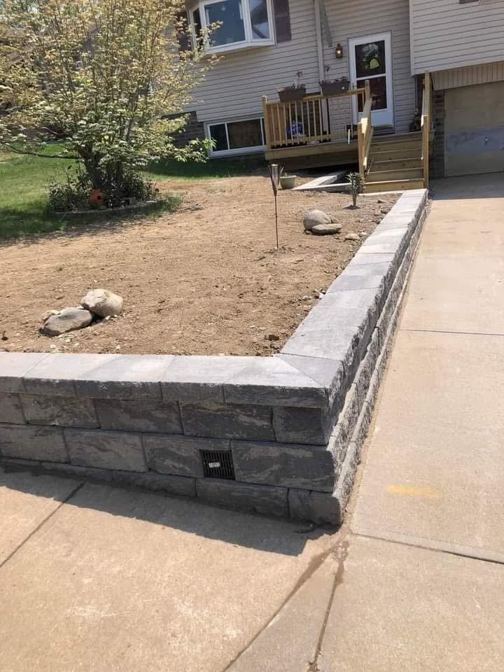Finished retaining wall along residential driveway