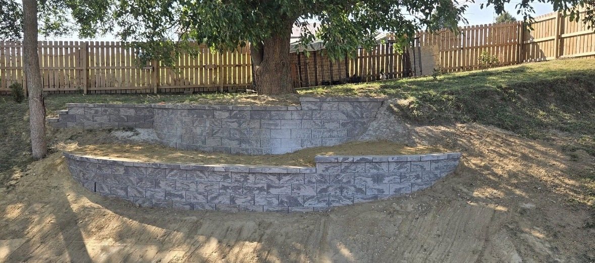 Tiered retaining wall system on sloped yard