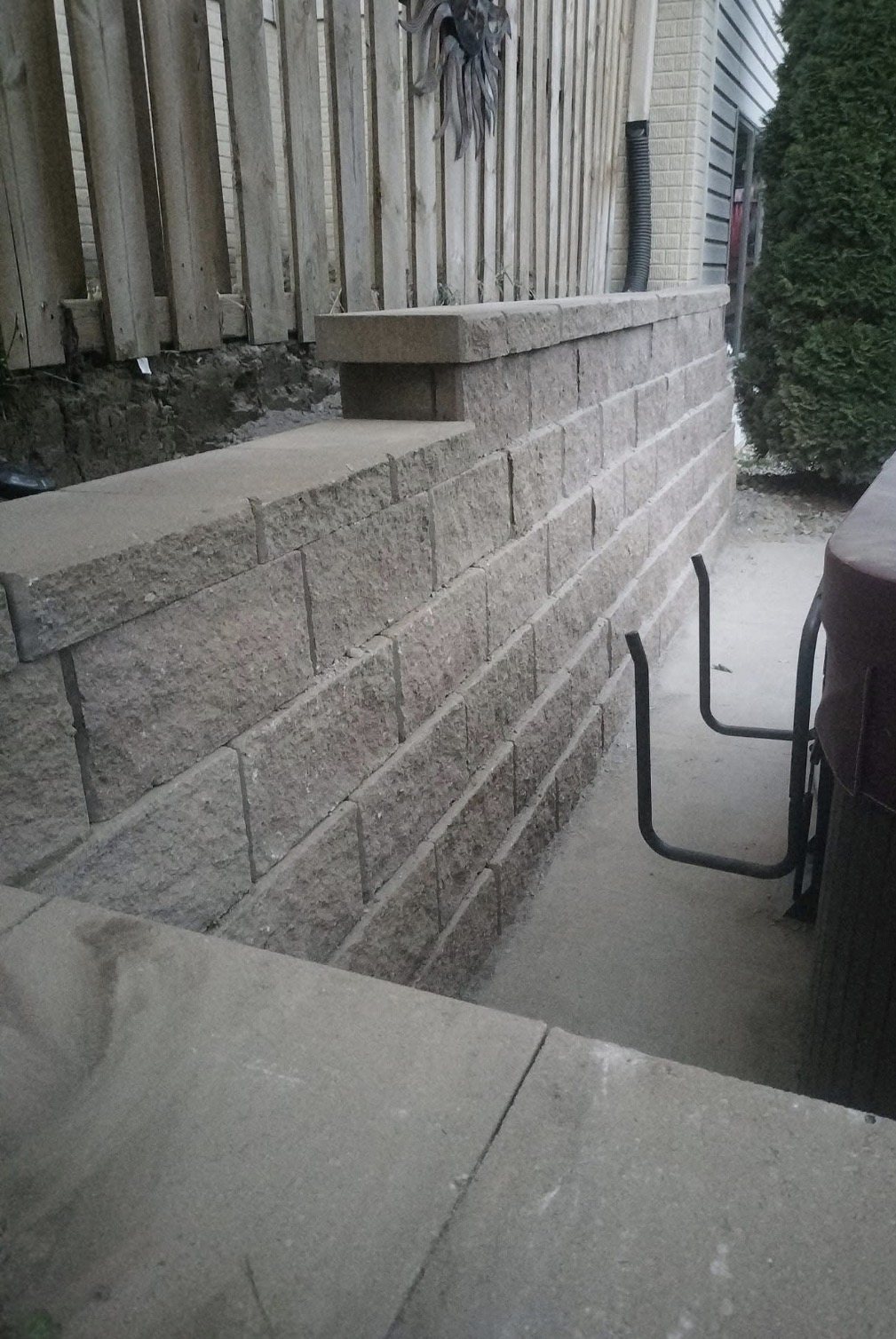 Retaining wall and cap detail beside patio