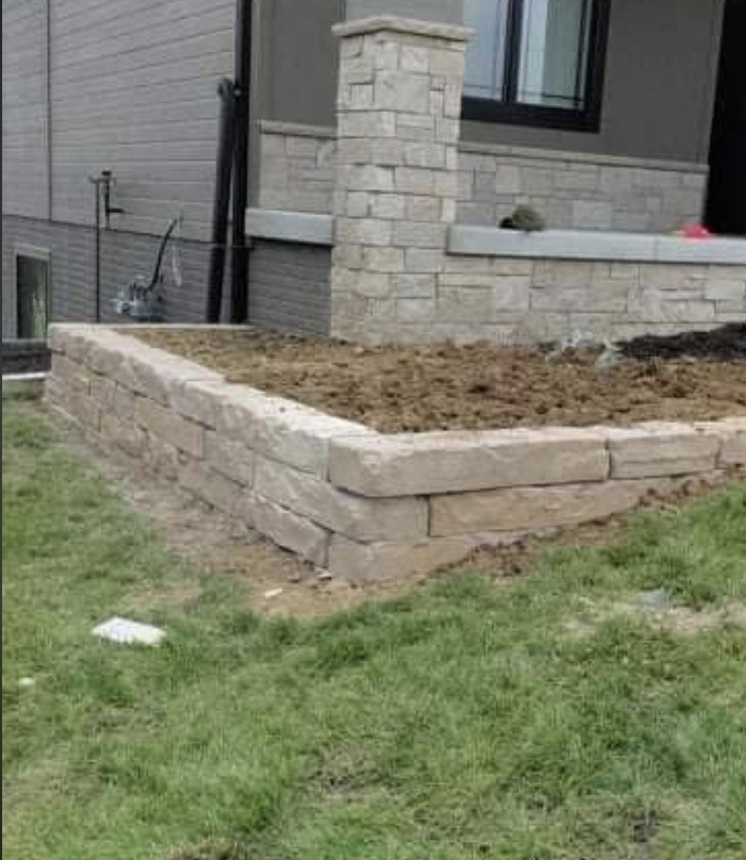 Landscape retaining wall beside home